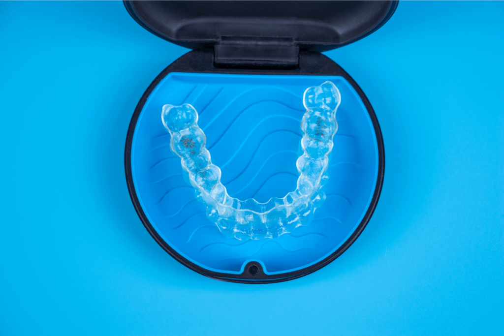 Invisalign clear aligners with blue case