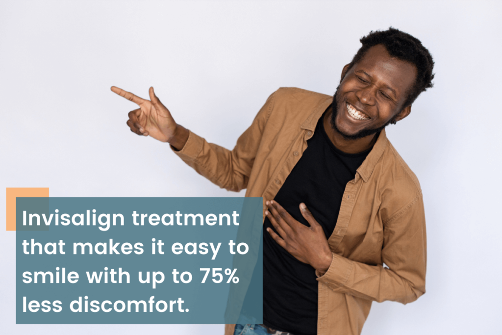 man smiling and pointing during Invisalign treatment at Dr. Peter Brawn enjoying up to 75% less discomfort